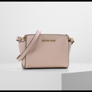Michael Kors Pink Small sized purse with satchel